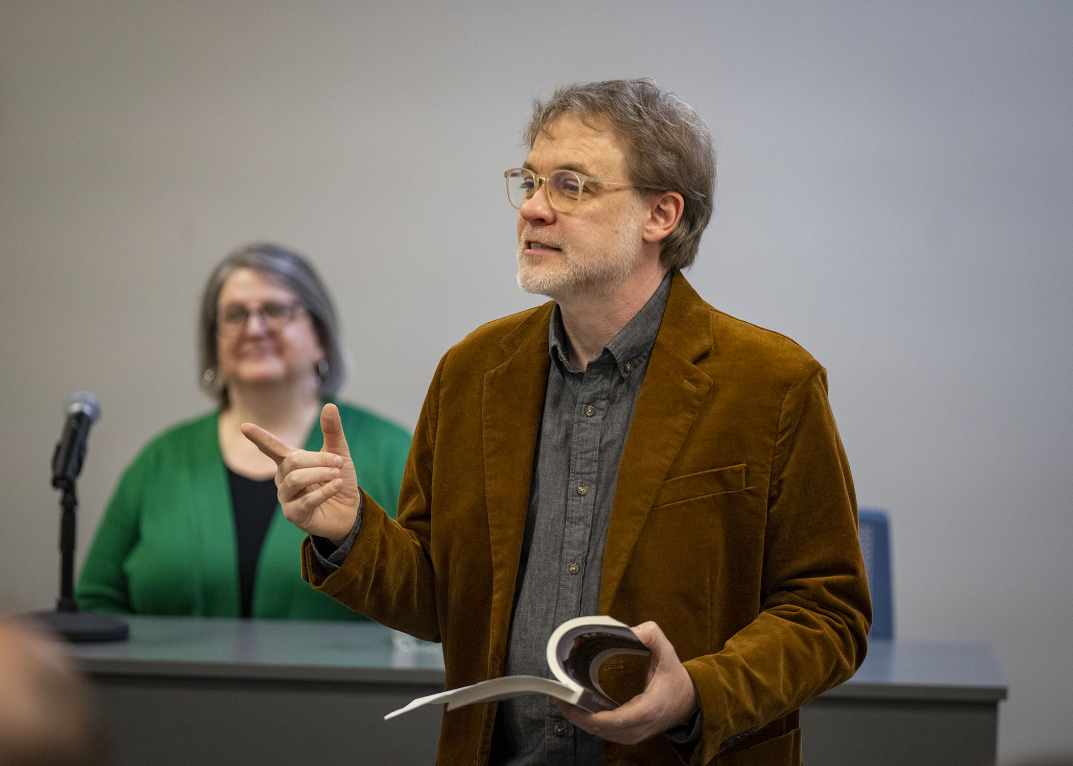 Dr. Jesse Graves welcomes the crowd for the 3 Emerging Writers' Event.