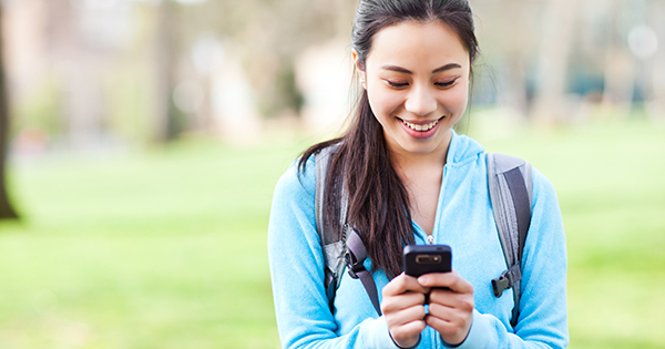 Student texting on her smartphone