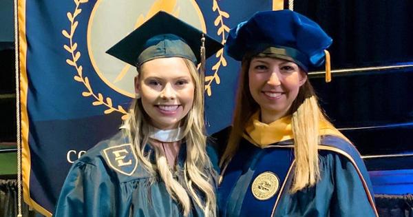 Student and teacher at graduation