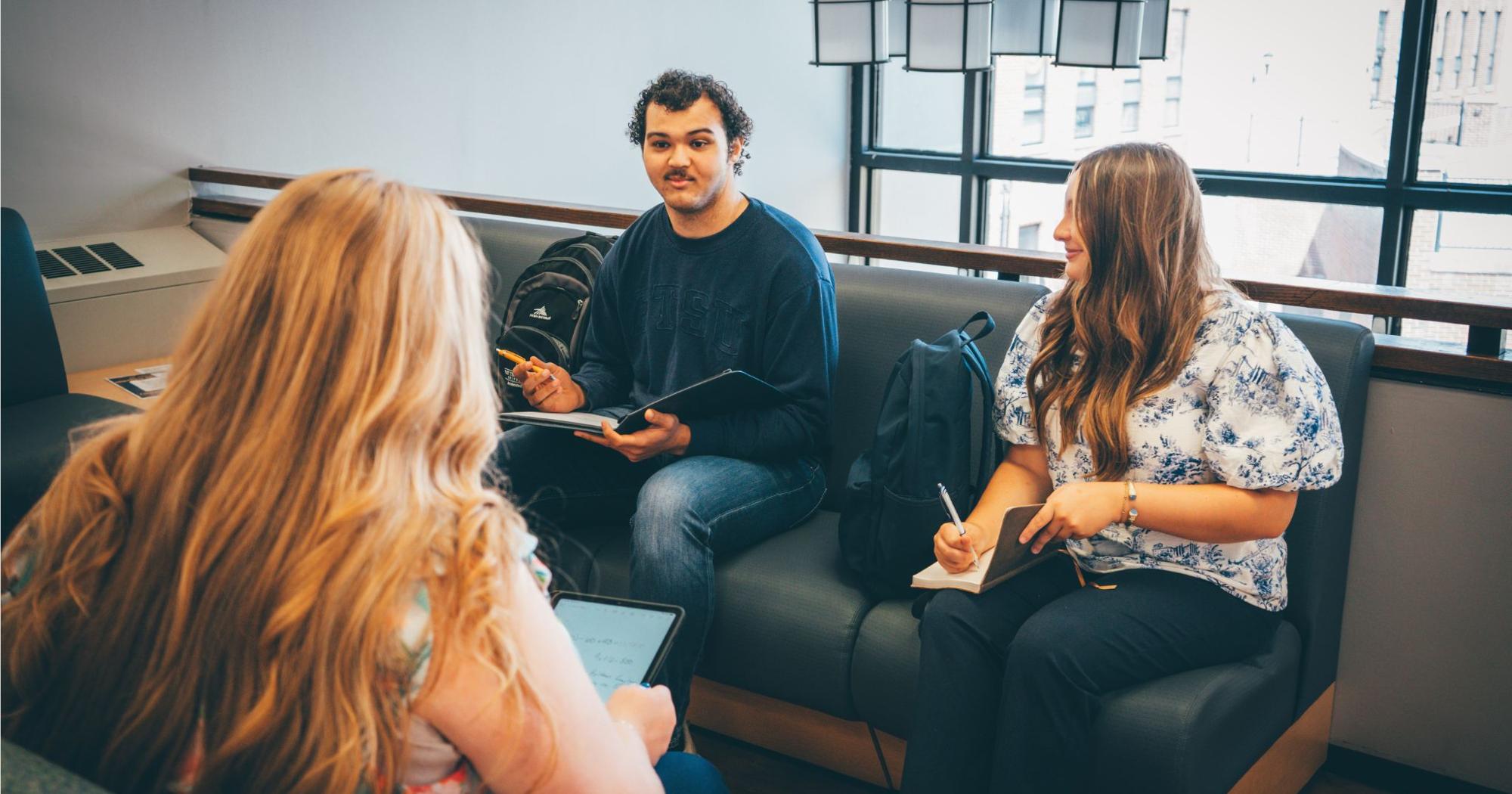 Three ETSU CBAT students sit together and study in Sam Wilson Hall.