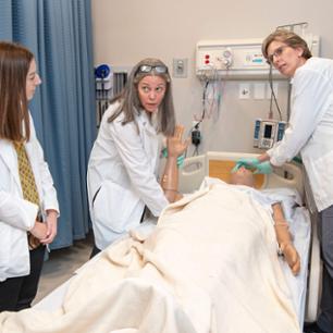 student measuring liquid in lab