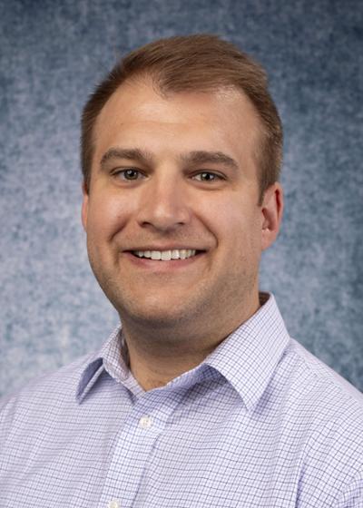 Dr. Bryan Mackowiak, Assistant Professor of Biomedical Sciences Department pictured wearing a white shirt. of Bryan Mackowiak