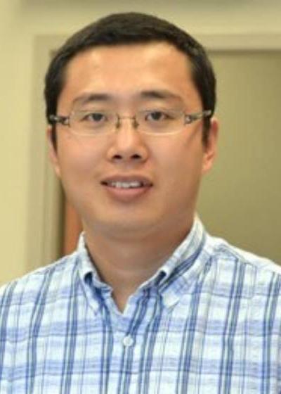 Dr. Xiaohui Wang, Assistant Professor of Biomedical Sciences Department pictured wearing a white shirt. of Xiaohui Wang