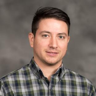 Dr. Chad R. Frasier, Associate Professor of Biomedical Sciences Department pictured wearing a plaid shirt. of Chad R. Frasier
