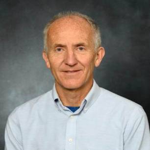 Dr. Thomas Ecay, Professor of the Department of Medical Education pictured wearing a white shirt. of Thomas Ecay