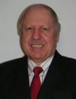 Dr. Richard Kostrzewa, Professor of Biomedical Sciences Department pictured wearing a suit and tie. of Richard Kostrzewa