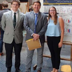 2nd year Quillen Medical Students, Patrick Means (left) and Suzanna Camp (right) pictured with Dr. Aaron Polichnowski (center) who presented their summer research projects at the 22nd Annual Quillen Medical Student Research Symposium in September, 2023.