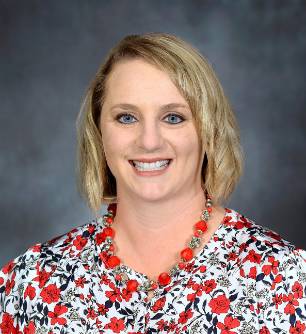 Crystal Maupin, Business Manager of Biomedical Sciences Department pictured wearing a white and red floral shirt. of Crystal Maupin