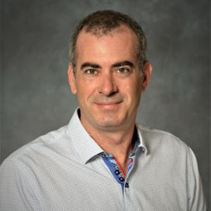 Dr. Eric Beaumont, Professor, Associate Dean for Research and Graduate Education in Biomedical Sciences Department pictured wearing a white shirt. of Eric Beaumont