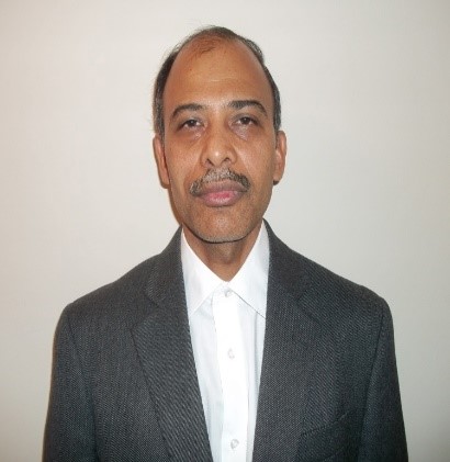 Dr. Sanjay Singh, Associate Professor of Biomedical Sciences Department pictured wearing a suit. of Sanjay Singh