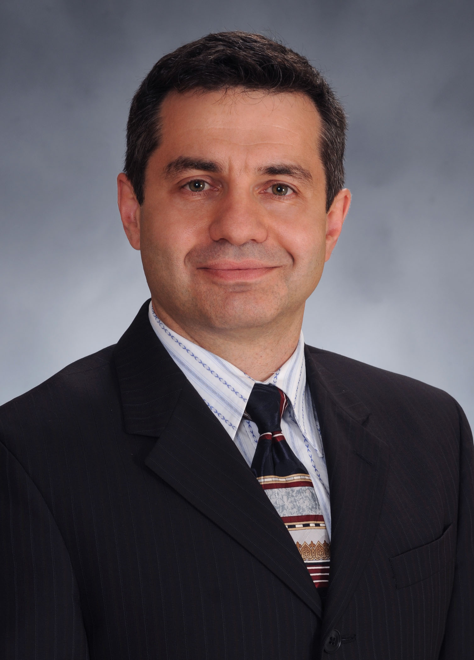 Dr. Valentin Yakubenko, Associate Professor of Biomedical Sciences Department pictured wearing a suit and tie. of Valentin Yakubenko