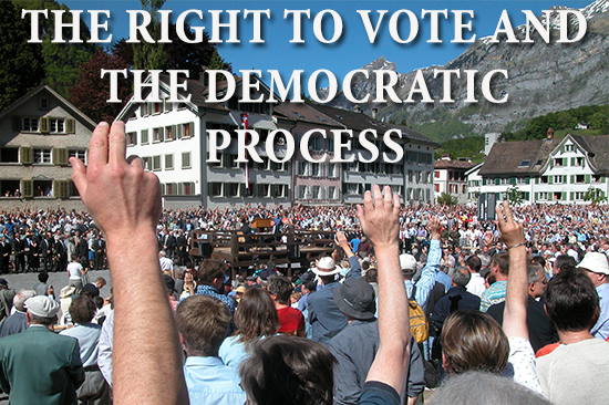 crowd of people with hands raised