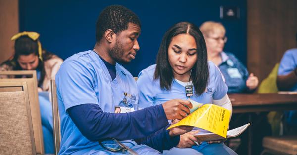 Two ETSU nursing students engaged in a discussion during a seminar