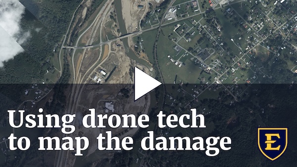 YouTube thumbnail depicting an overhead view of the flood damage. The text reads 